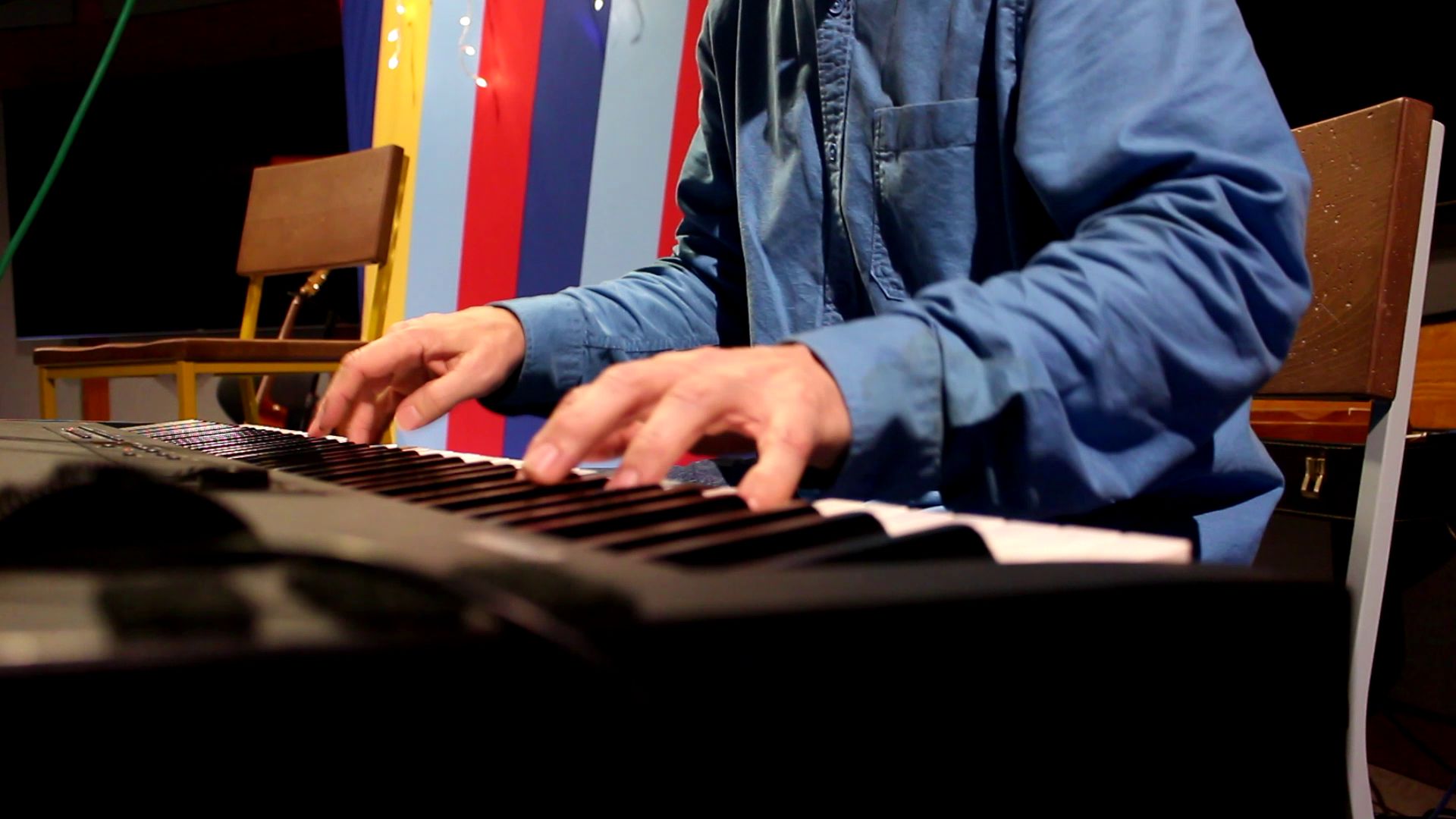 Lawrence songwriter Michael Paull plays piano at the Singer-Songwriter Showcase
